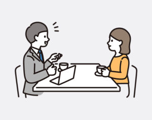 対面で人が話している様子
